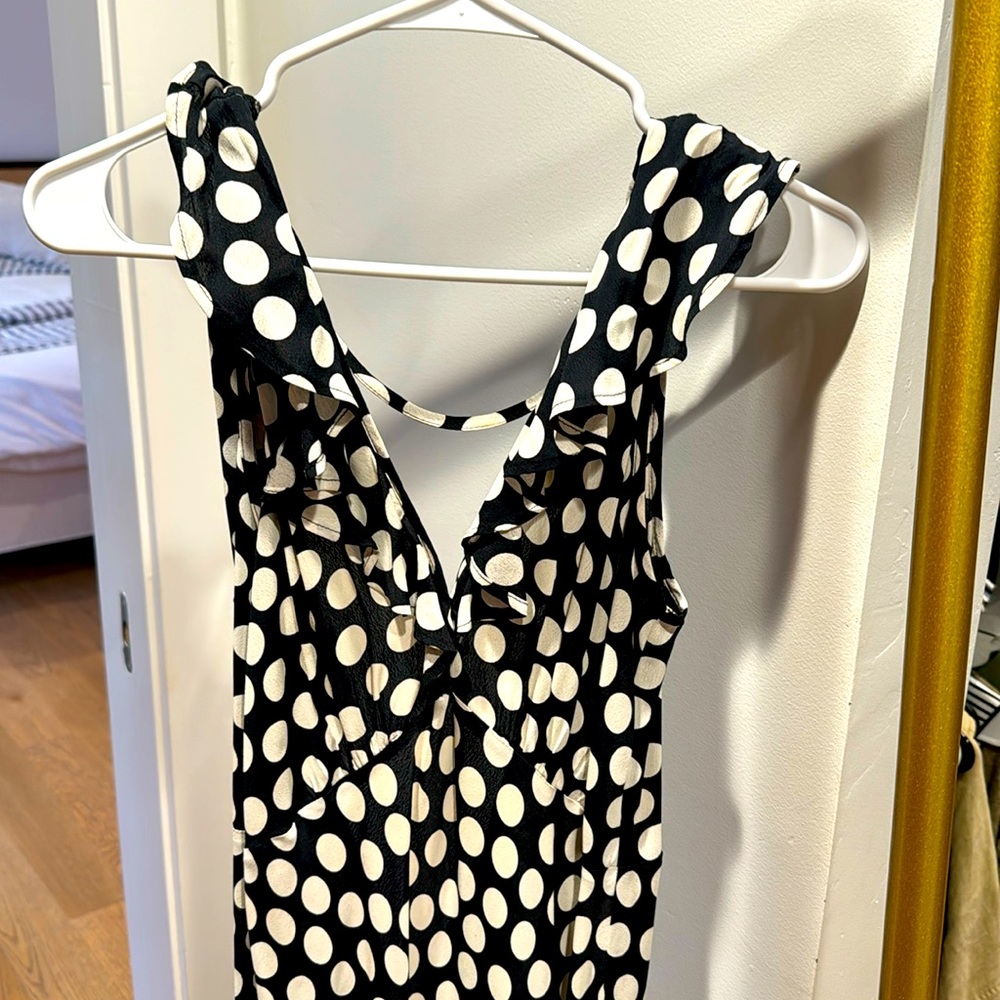 Long flowy dress with low back and ruffle bottom